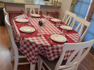 350730001-aa-dining-table-showing-table-cloth-place-mats-added-to-protect-from-further-damage-to-new-table