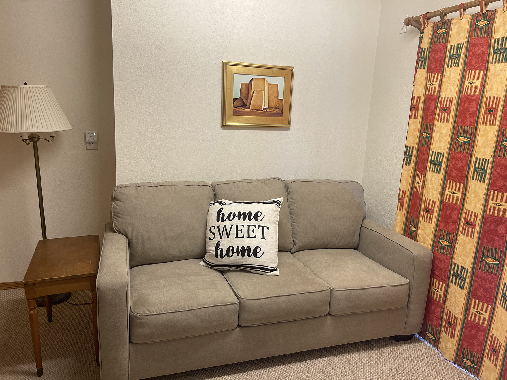 350730033-aa-sofa-sleeper-room-with-usb-port-decorative-pillow-piano-bench-legs-were-tightened-up-to-use-for-end-table